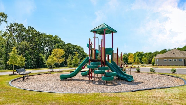 community jungle gym with a yard