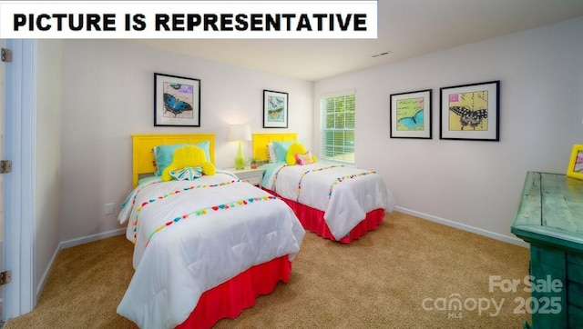 carpeted bedroom with visible vents and baseboards