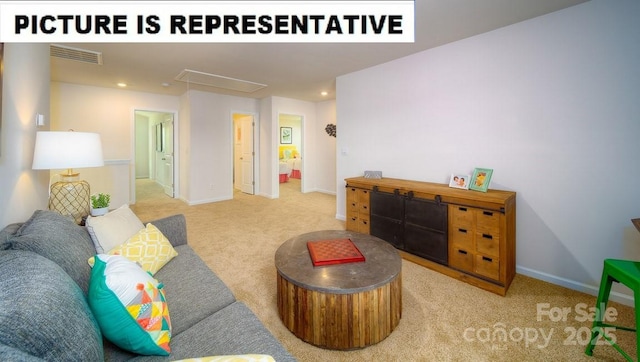 living room with attic access, carpet flooring, visible vents, and baseboards