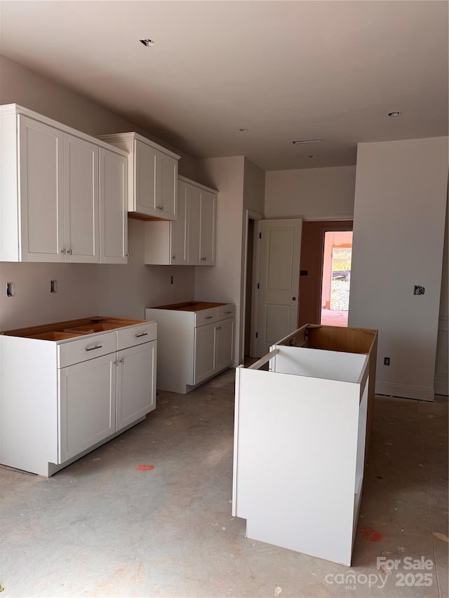 713 Inwood Hill Dr Unit 96, Gastonia, NC 28056 - kitchen featuring a kitchen island and concrete flooring