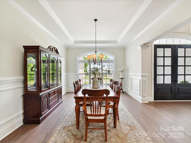 873 Penny Royal Ave, Fort Mill, SC 29715 - dining room featuring french doors, a chandelier, a tray ceiling, wood finished floors, and a decorative wall