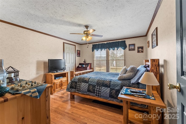 bedroom with light wood-type flooring, a textured ceiling, crown molding, ceiling fan, and a textured wall