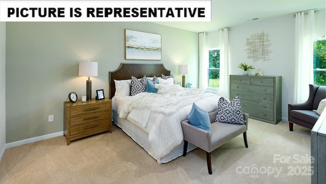 carpeted bedroom with visible vents and baseboards