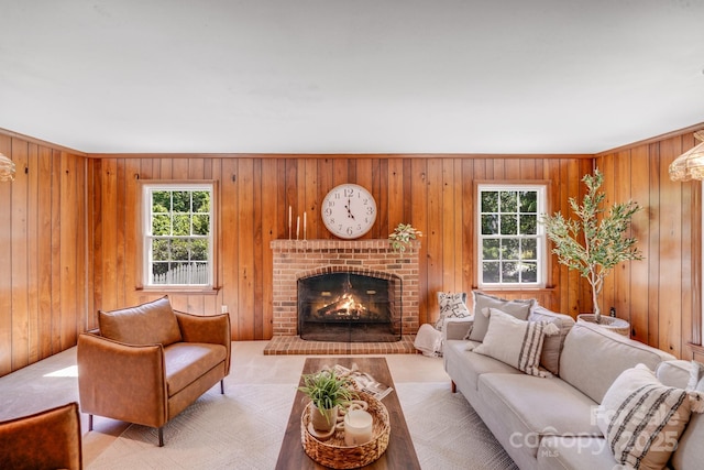 carpeted living room featuring a fireplace, wood walls, and a wealth of natural light