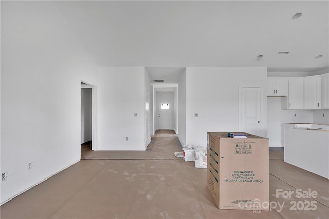 8455 W NC-152 Hwy, Mooresville, NC 28115 - kitchen with white cabinetry, a kitchen island, and concrete floors
