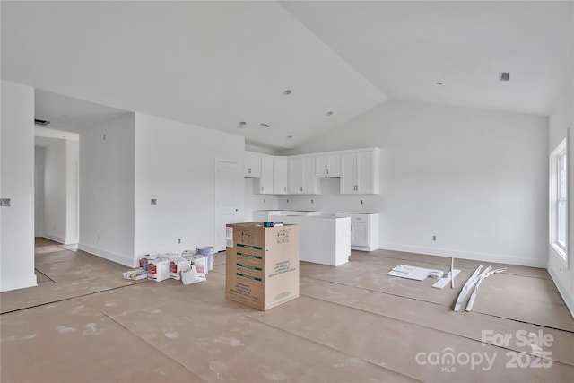 8455 W NC-152 Hwy, Mooresville, NC 28115 - kitchen with a kitchen island, white cabinets, and high vaulted ceiling