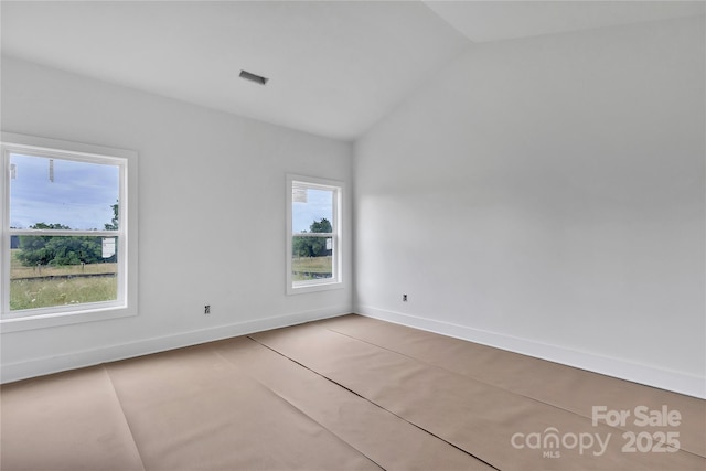 8455 W NC-152 Hwy, Mooresville, NC 28115 - empty room with plenty of natural light and vaulted ceiling