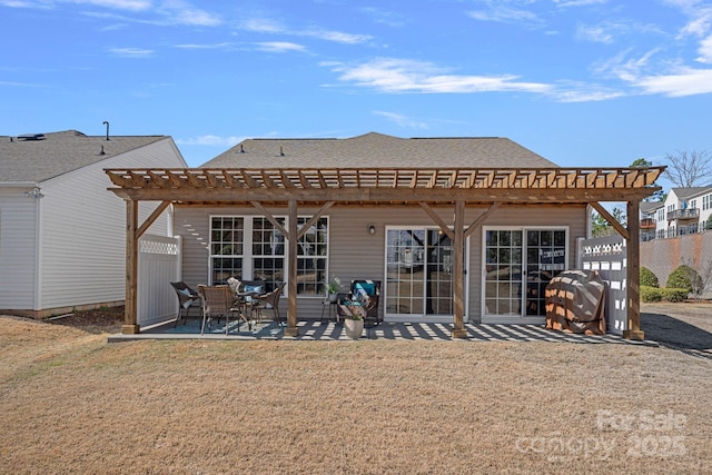 rear view of house with a patio area, fence, a lawn, and a pergola