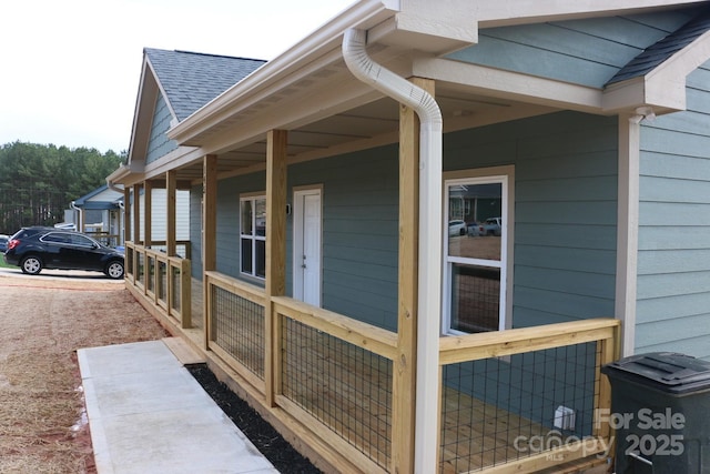 view of property exterior with roof with shingles