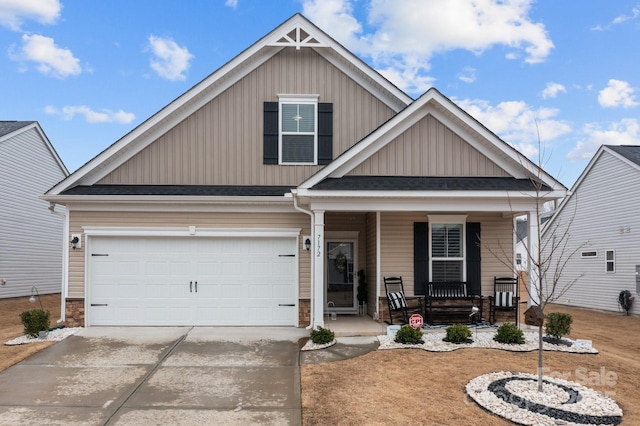 7172 Indigo Way, Denver, NC 28037 - craftsman-style house with covered porch, driveway, board and batten siding, and a garage