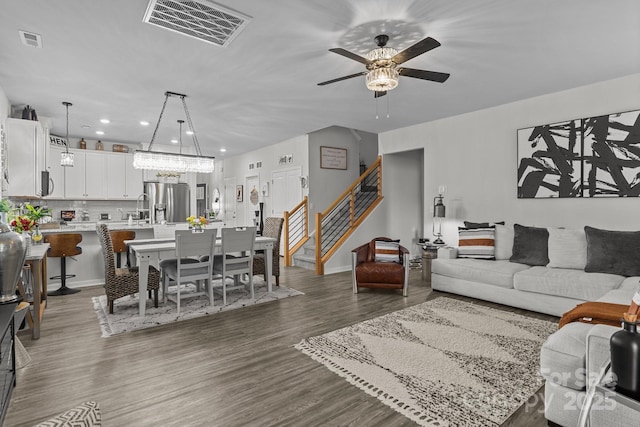 7172 Indigo Way, Denver, NC 28037 - living area with a ceiling fan, wood finished floors, recessed lighting, stairs, and baseboards