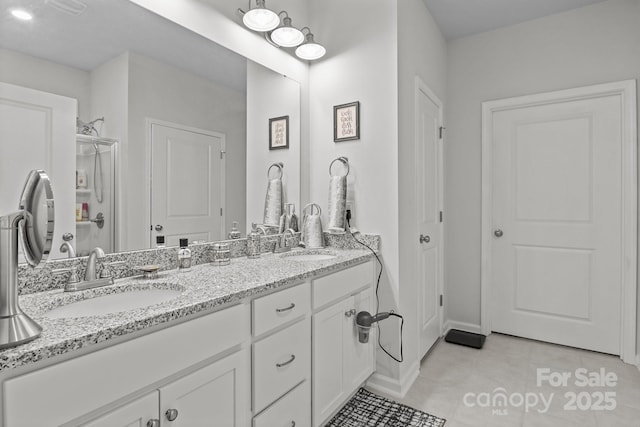 7172 Indigo Way, Denver, NC 28037 - full bathroom with double vanity, baseboards, tile patterned floors, and a shower