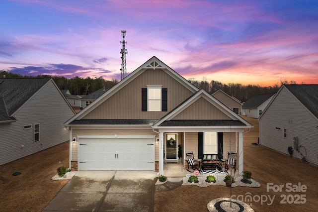7172 Indigo Way, Denver, NC 28037 - view of front facade with covered porch, board and batten siding, concrete driveway, a garage, and a shingled roof