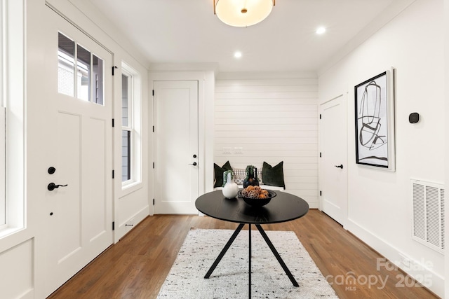entryway with recessed lighting, wood finished floors, and visible vents