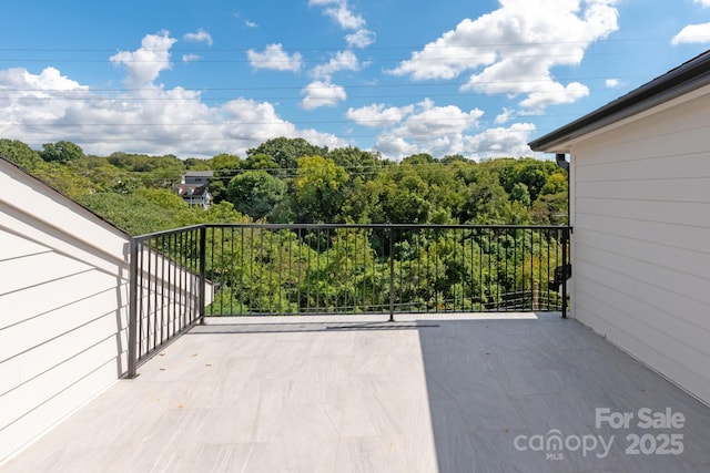view of patio with a balcony