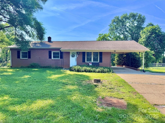 817 Dudley Shoals Rd, Granite Falls, NC 28630 - single story home featuring a front lawn, brick siding, an attached carport, a chimney, and driveway