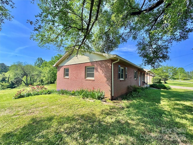 817 Dudley Shoals Rd, Granite Falls, NC 28630 - view of side of property featuring a lawn and brick siding