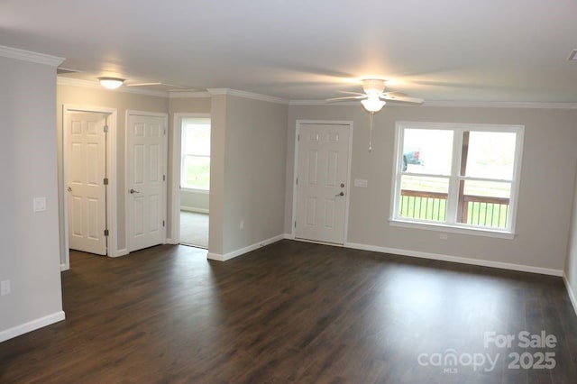 interior space with baseboards, crown molding, ceiling fan, and dark wood-style flooring