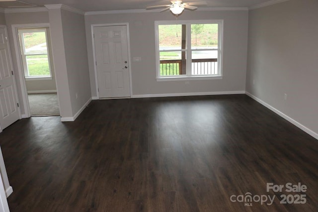 foyer with dark wood finished floors, baseboards, ceiling fan, and crown molding