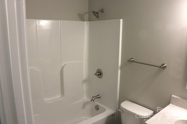 full bathroom featuring vanity, toilet, and washtub / shower combination