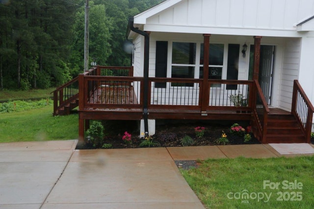 deck with stairway and a porch