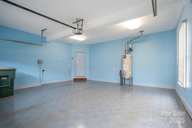 garage featuring gas water heater, a garage door opener, and baseboards