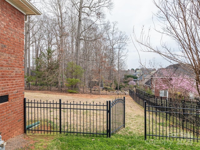 view of yard with a gate and fence