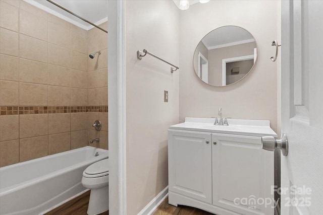 bathroom featuring shower / washtub combination, toilet, crown molding, and wood finished floors