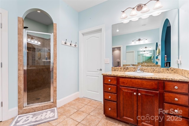 4858 Sagittarius Cir, Denver, NC 28037 - bathroom featuring a shower stall, tile patterned flooring, vanity, and baseboards