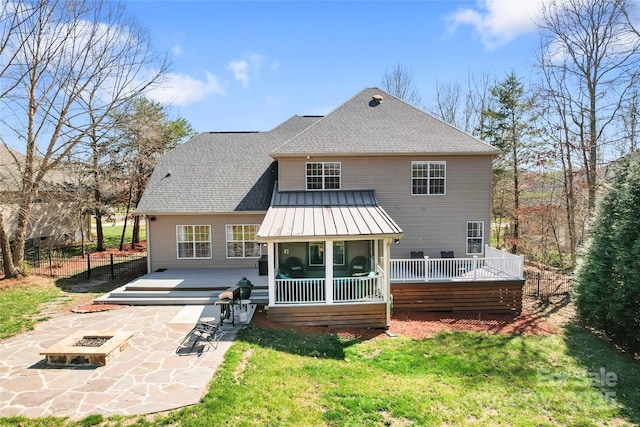4858 Sagittarius Cir, Denver, NC 28037 - rear view of house with a fire pit, a sunroom, a patio, and a wooden deck