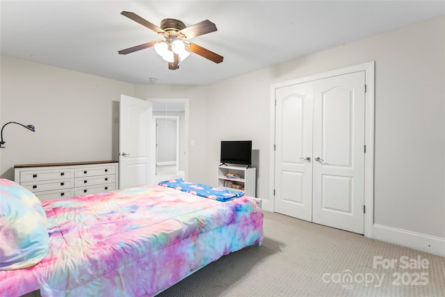 4858 Sagittarius Cir, Denver, NC 28037 - bedroom with light carpet, a closet, ceiling fan, and baseboards