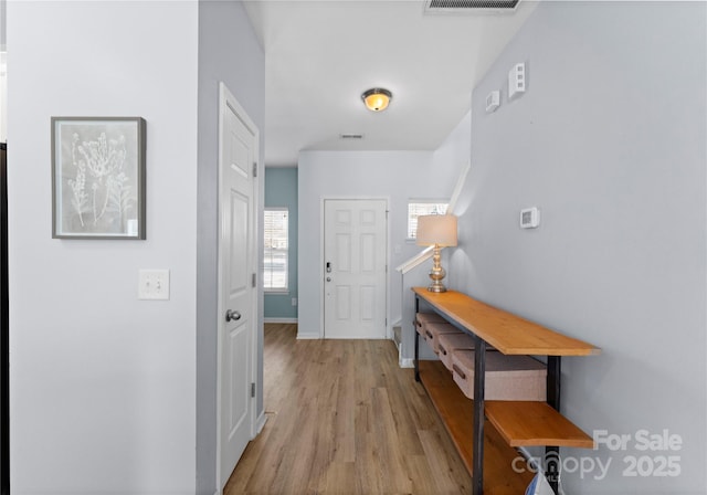 2259 Crosscut Dr, Charlotte, NC 28214 - foyer featuring light wood-style flooring and baseboards