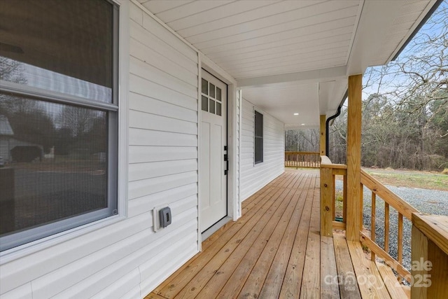 wooden deck featuring covered porch