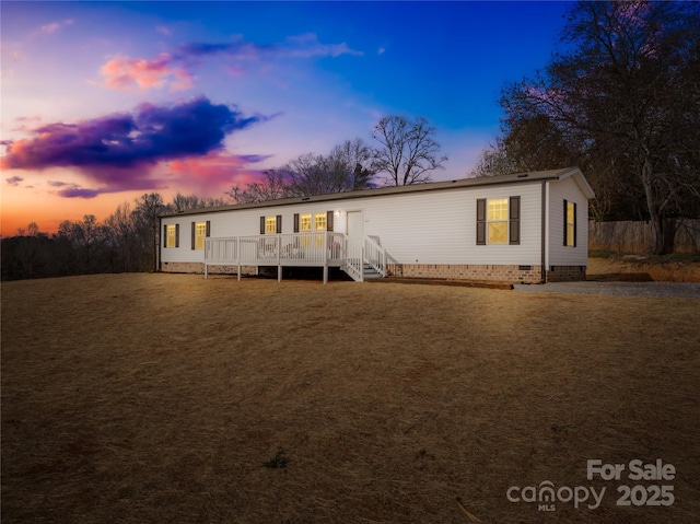 manufactured / mobile home featuring crawl space and a wooden deck