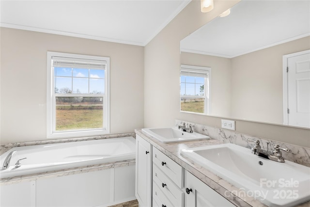 full bathroom with a garden tub, ornamental molding, double vanity, and a sink