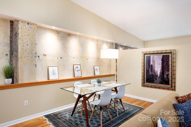 32 Broadway St Unit 330, Asheville, NC 28801 - dining area featuring wood finished floors, lofted ceiling, and baseboards