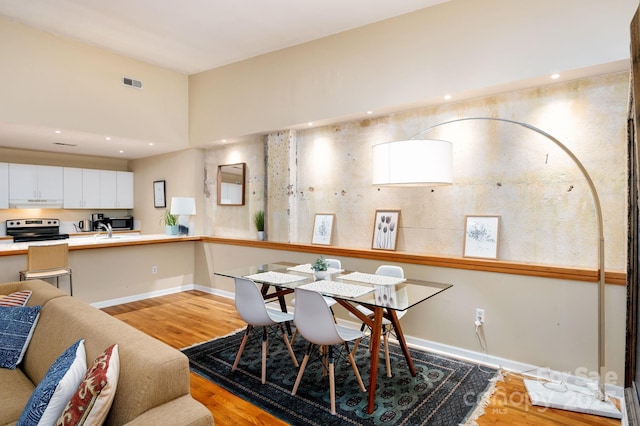 32 Broadway St Unit 330, Asheville, NC 28801 - dining room featuring light wood-style floors and baseboards