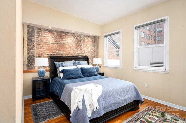 32 Broadway St Unit 330, Asheville, NC 28801 - bedroom featuring wood finished floors and baseboards
