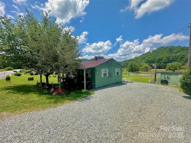 122 Church Hollow Rd, Boone, NC 28607 - view of side of property featuring a yard, a metal roof, and gravel driveway