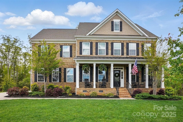 5140 Oak Grove Pl, Waxhaw, NC 28173 - colonial home featuring a front yard, a shingled roof, brick siding, and covered porch