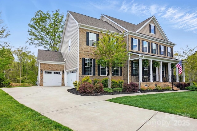 5140 Oak Grove Pl, Waxhaw, NC 28173 - view of front facade featuring brick siding, driveway, a front lawn, and crawl space