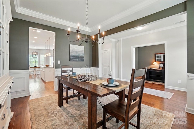 5140 Oak Grove Pl, Waxhaw, NC 28173 - dining room with crown molding, an inviting chandelier, dark wood-style floors, and visible vents