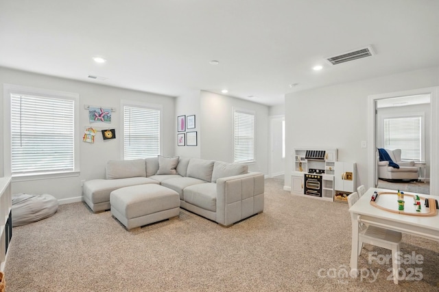 5140 Oak Grove Pl, Waxhaw, NC 28173 - living room with visible vents, baseboards, carpet floors, and a healthy amount of sunlight
