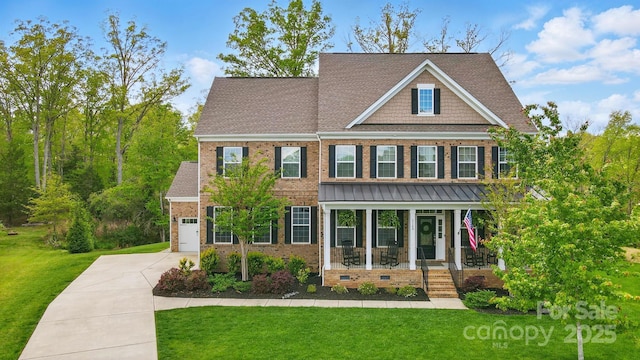 5140 Oak Grove Pl, Waxhaw, NC 28173 - craftsman house featuring a porch, brick siding, driveway, and a front yard