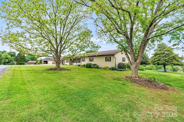 2 Honeysuckle Way, Granite Falls, NC 28630 - view of grassy yard with a garage