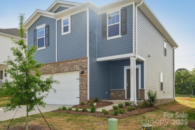 1305 31st St NE, Conover, NC 28613 - view of front facade featuring an attached garage, concrete driveway, and brick siding