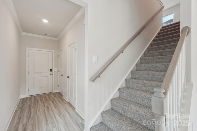 1305 31st St NE, Conover, NC 28613 - stairs with wood finished floors, baseboards, and ornamental molding