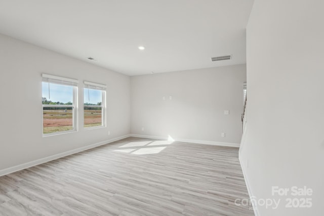 1305 31st St NE, Conover, NC 28613 - spare room with baseboards, recessed lighting, light wood-style flooring, and visible vents
