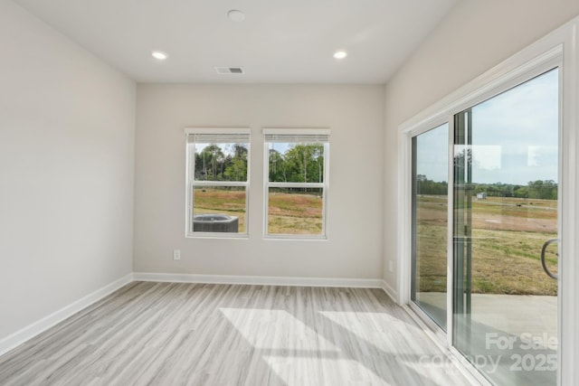 1305 31st St NE, Conover, NC 28613 - unfurnished room with baseboards, light wood finished floors, recessed lighting, and visible vents