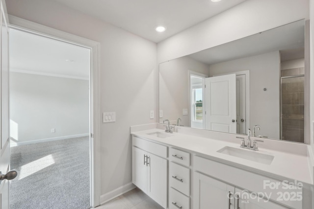 1305 31st St NE, Conover, NC 28613 - full bathroom with baseboards, recessed lighting, double vanity, and a sink